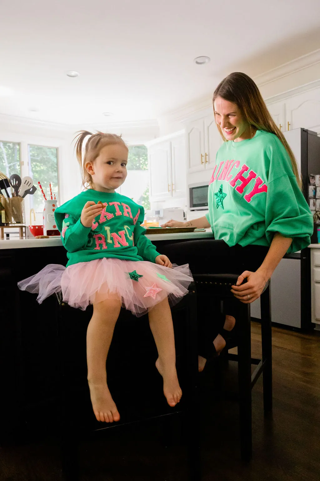 GRINCHY PINK VARSITY PULLOVER